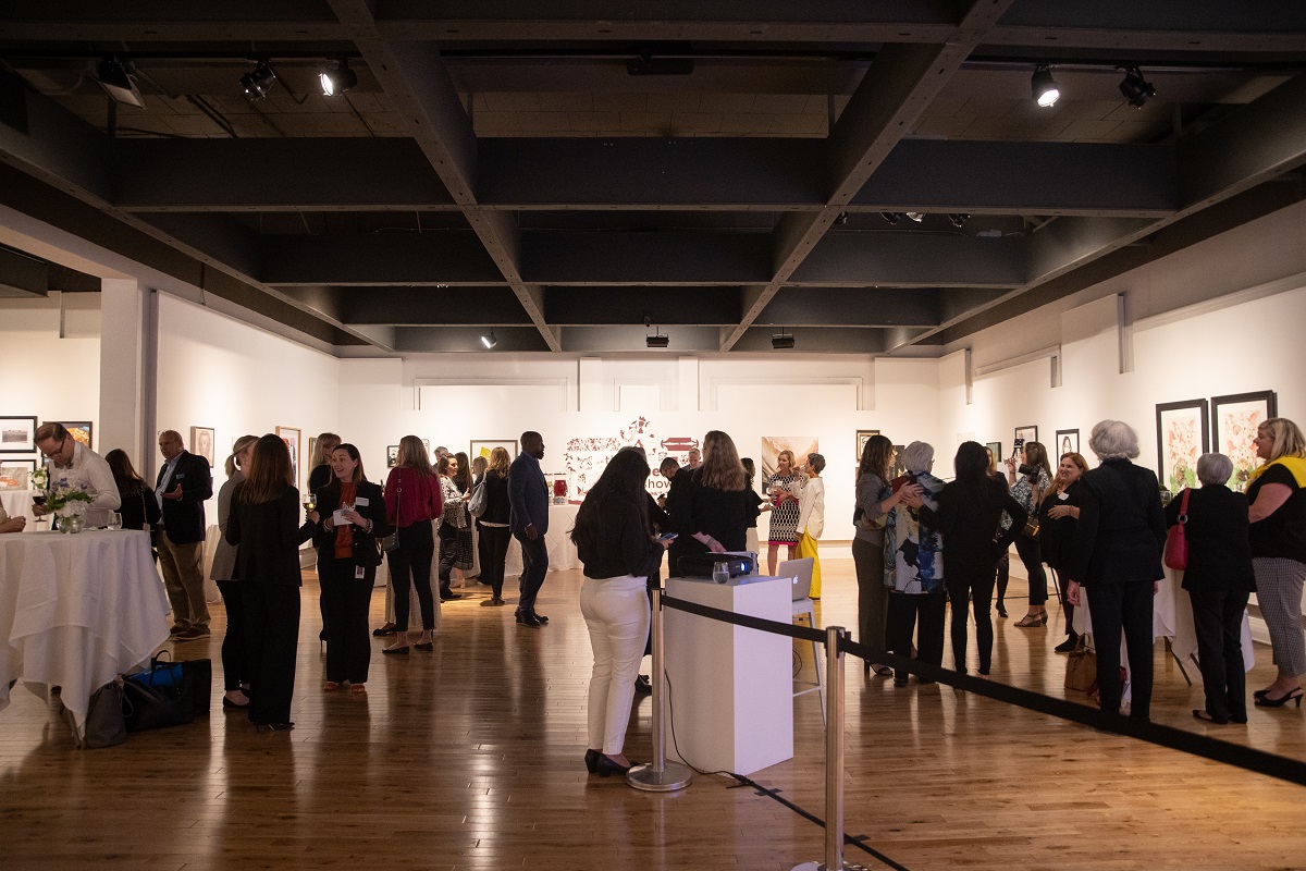 A photo of people at a cocktail reception at the Pensacola Museum of Art.